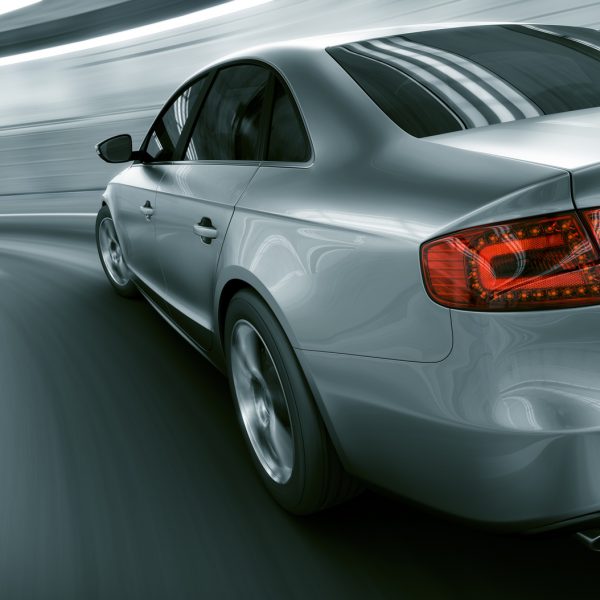3d rendering of a brandless generic car of my own design in a tunnel with heavy motion blur